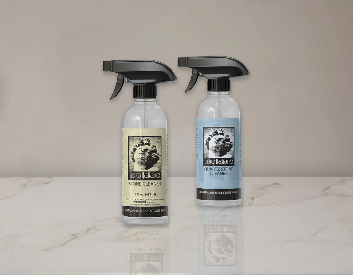 Two bottles of Stone & Tile Cleaner on a marble surface with a neutral background
